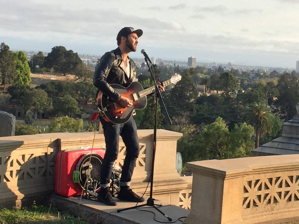 Shakey Graves singing on the stairs